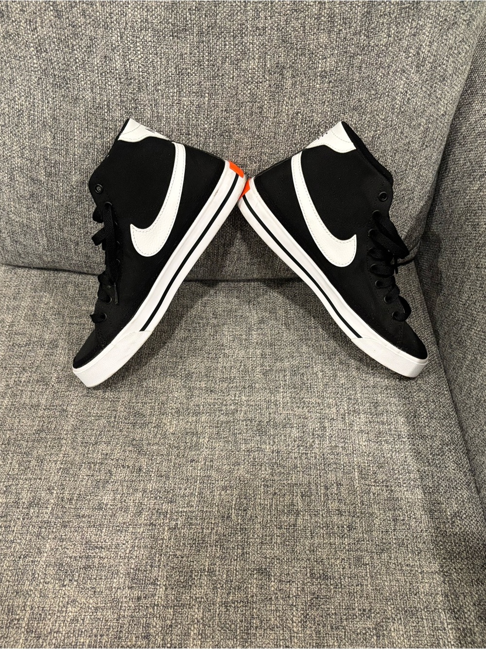 Nike Women’s Black and White High-Top Sneakers with Orange Accent